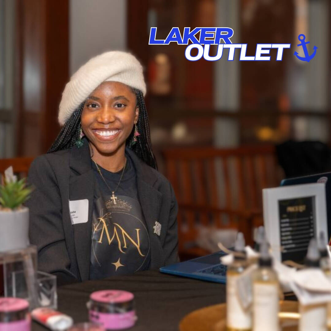 African American Woman sitting behind table
